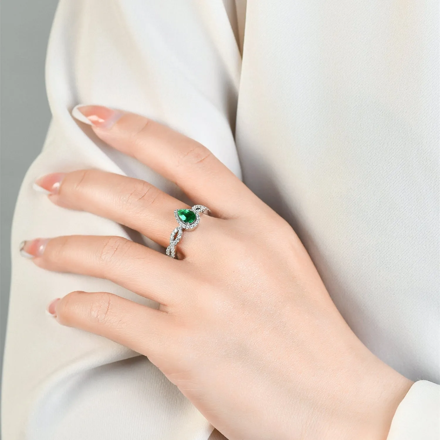 Pear Cut Emerald Ring with Diamond Halo