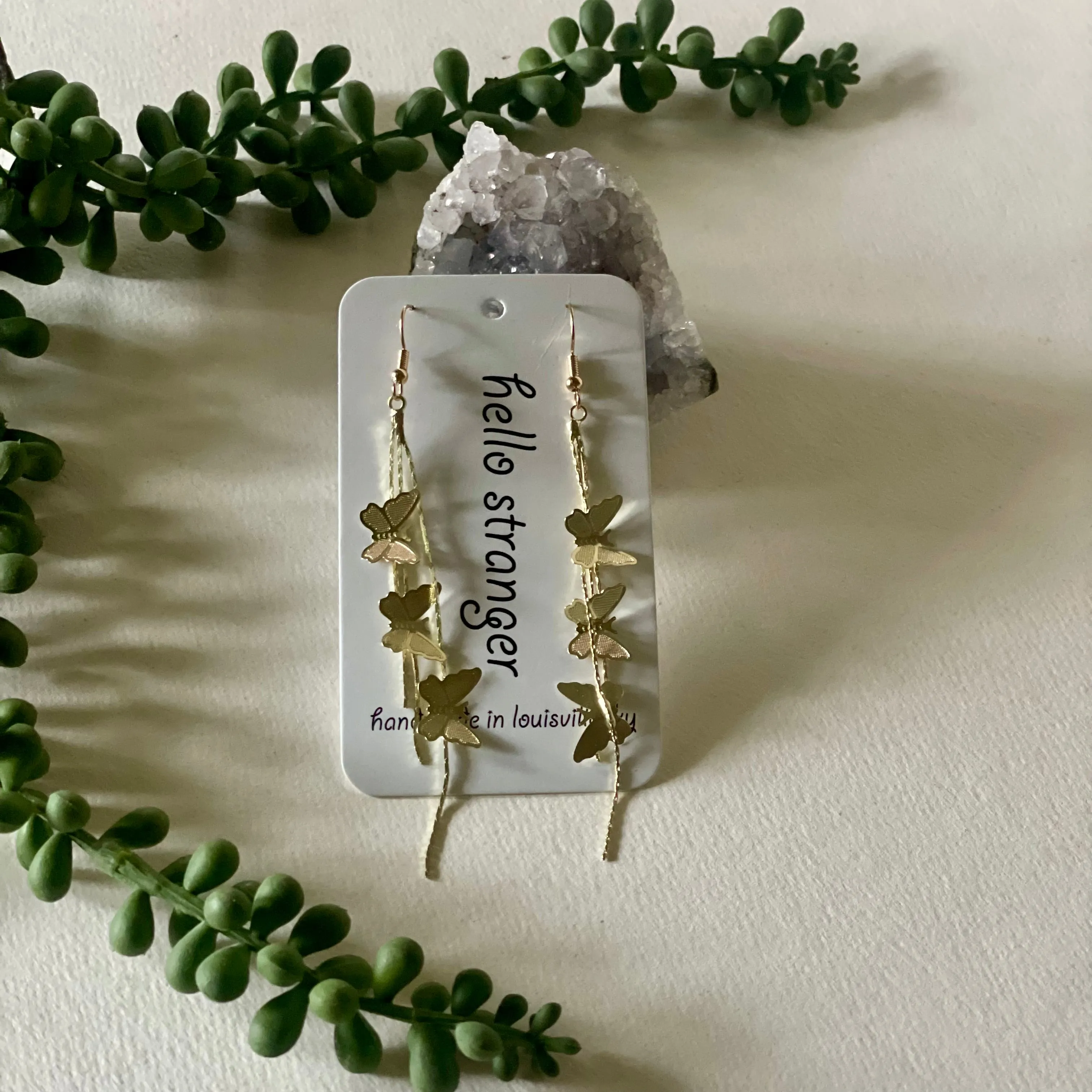Y2K style butterfly waterfall earrings in gold // hello stranger